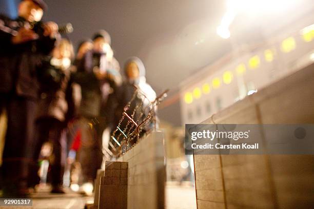 Miniature replicas of the Berlin wall are displayed at the Brandenburg Gate to commemorate the 20th anniversary of fall of the Berlin Wall on...