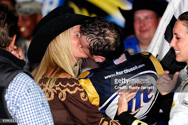 Kurt Busch, driver of the Miller Lite Dodge, kisses wife Eva Busch on victory lane after winning the NASCAR Sprint Cup Series Dickies 500 at Texas...