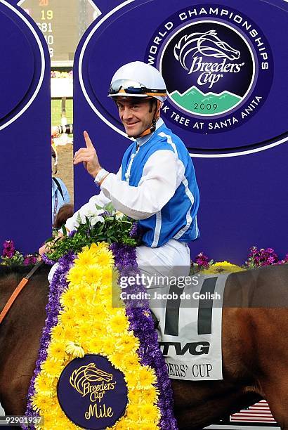 Jockey Olivier Peslier celebrates winning the TVG Breeders' Cup Mile race with Goldikova during the Breeders' Cup World Championships at Santa Anita...