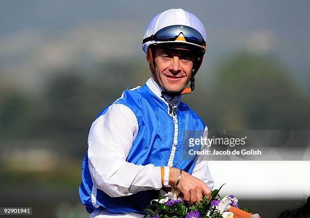 Jockey Olivier Peslier celebrates winning the TVG Breeders' Cup Mile race with Goldikova during the Breeders' Cup World Championships at Santa Anita...