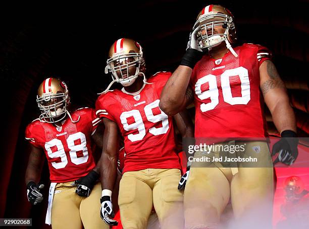 Parys Haralson, Manny Lawson and Isaac Sopoaga of the San Francisco 49ers wait to be introduced in NFL action against the Tennessee Titans on...