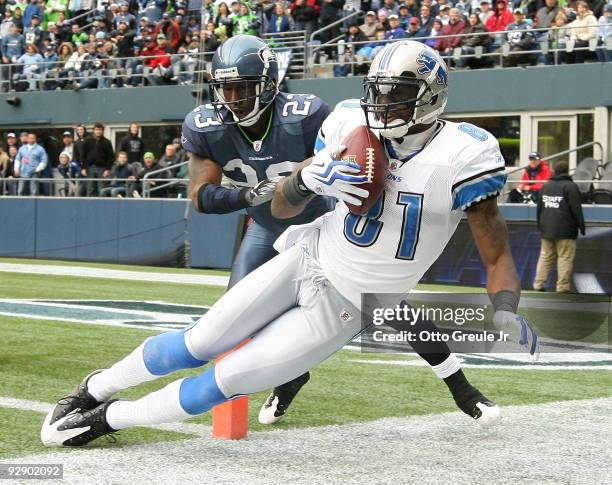 Wide receiver Calvin Johnson of the Detroit Lions makes a catch at the one-yard line against Marcus Trufant of the Seattle Seahawks on November 8,...