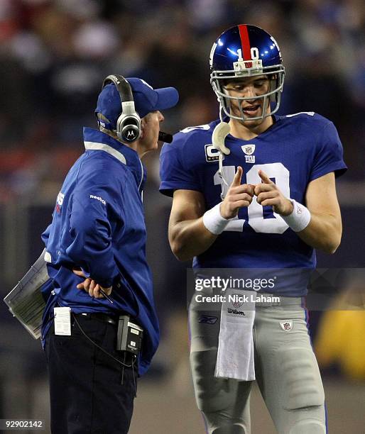 Head coach Tom Coughlin of the New York Giants talks with Eli Manning against the San Diego Chargers at Giants Stadium on November 8, 2009 in East...