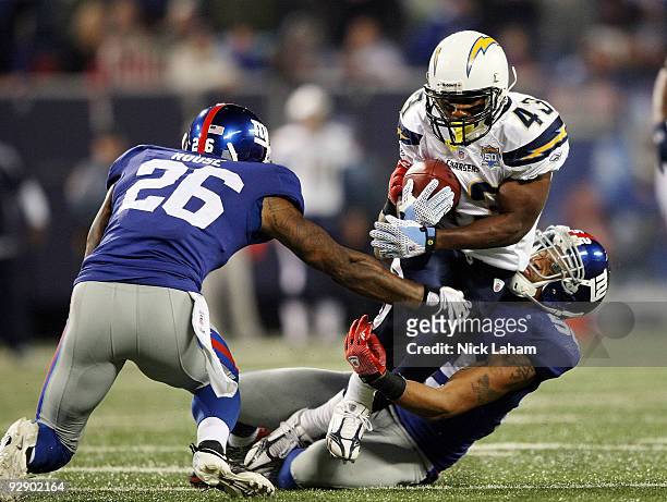 Michael Boley of the New York Giants tackles Darren Sproles of the San Diego Chargers at Giants Stadium on November 8, 2009 in East Rutherford, New...
