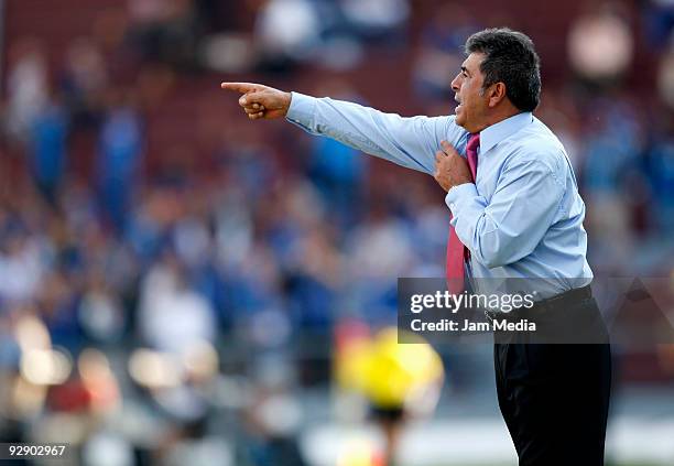 Queretaro's Head Coach Carlos Reinoso gestures during their match in the 2009 Opening tournament, the closing stage of the Mexican Football League,...