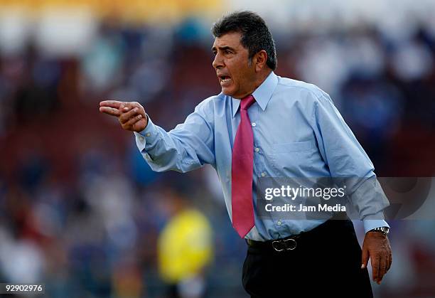 Queretaro' Head Coach Carlos Reinoso gestures during their match in the 2009 Opening tournament, the closing stage of the Mexican Football League, at...