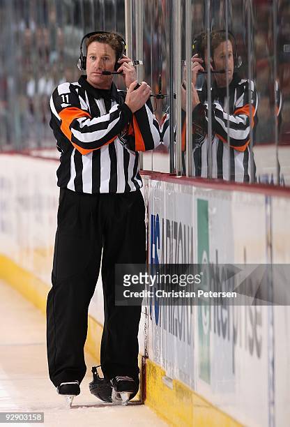 Referee Kelly Sutherland waits for a ruling on an overturned goal by the Chicago Blackhawks during the NHL game against the Phoenix Coyotes at...