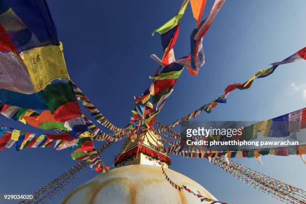 bodnath stupa with prayer flags, kathmandu, nepal. - katmandu stock pictures, royalty-free photos & images