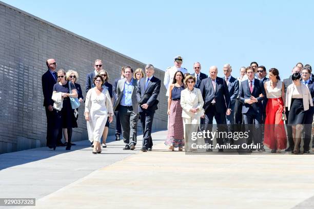 King Harald V of Norway, Queen Sonja of Norway, Vice Mayor of Buenos Aires Diego Santilli and his wife Analia Maiorana walk next to a wall with the...
