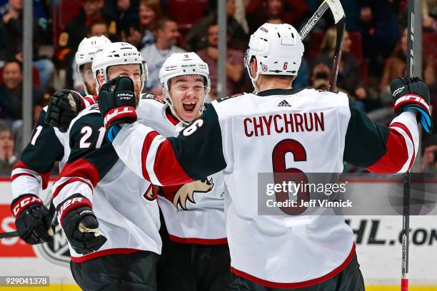 Derek Stepan of the Arizona Coyotes is congratulated by teammates after scoring during their NHL game against the Vancouver Canucks at Rogers Arena...