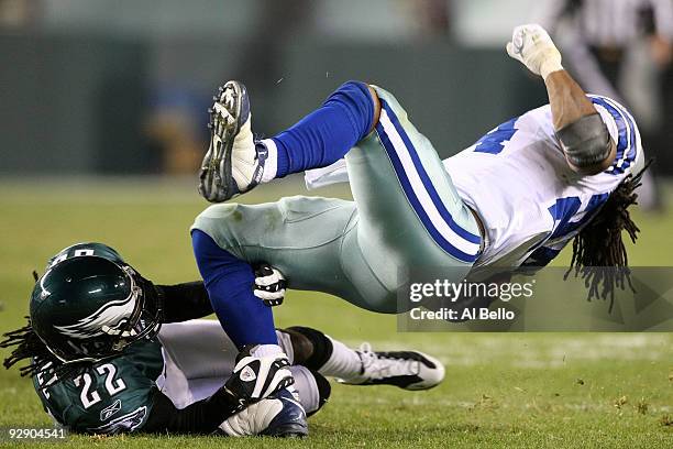 Asante Samuel of the Philadelphia Eagles tackles Marion Barber of the Dallas Cowboys at Lincoln Financial Field on November 8, 2009 in Philadelphia,...