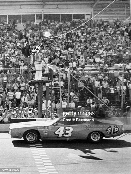 Richard Petty takes the checkered flag winning the Winston Cup Music City 420 NASCAR Race for the eighth time in ten years. Twenty-eight cars started...