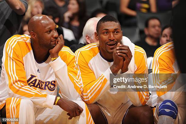 Lamar Odom and Ron Artest of the Los Angeles Lakers look on from the bench during a game against the New Orleans Hornets at Staples Center on...
