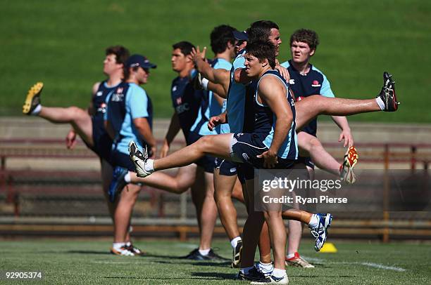 Players stretch during a Waratahs Super 14 pre-season training session at Brookvale Oval on November 9, 2009 in Sydney, Australia.