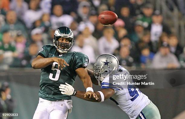 Quarterback Donovan McNabb of the Philadelphia Eagles throws a pass as linebacker Anthony Spencer of the Dallas Cowboys defends during a game on...