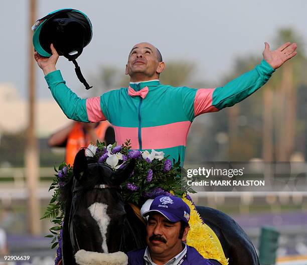 Jockey Mike Smith celebrates after winning the five million-dollar Breeders' Cup Classic race on the horse Zenyatta, owned by Jerome S. Moss, during...