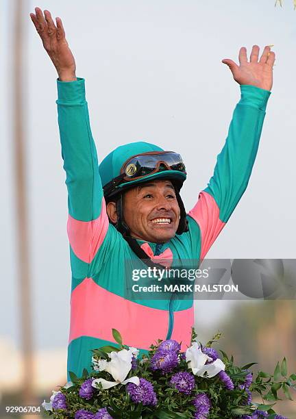 Jockey Mike Smith celebrates after winning the five million-dollar Breeders' Cup Classic race on the horse Zenyatta, owned by Jerome S. Moss, during...