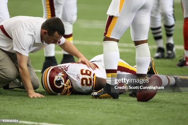 Clinton Portis of the Washington Redskins suffers a concussion on a play against the Atlanta Falcons at the Georgia Dome on November 8, 2009 in...