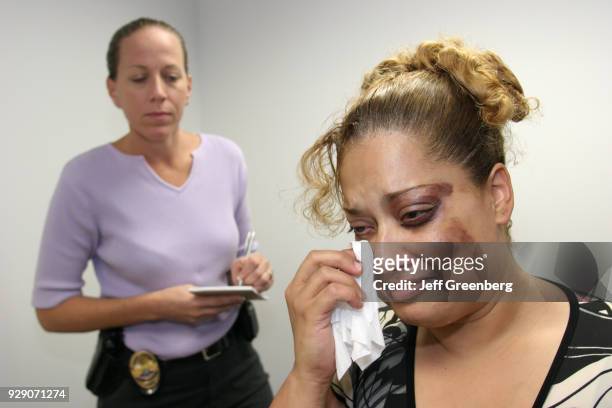 Detective interviews an abuse victim in the Police Department at North Miami Beach.