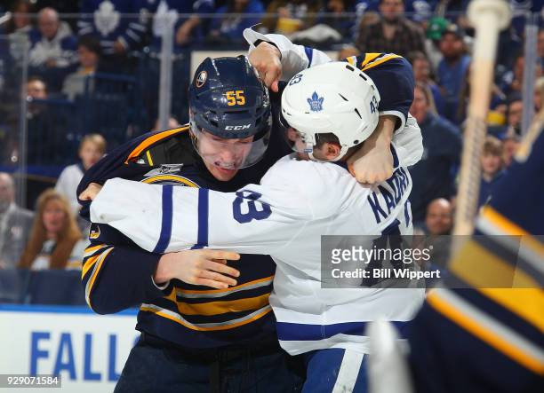 Rasmus Ristolainen of the Buffalo Sabres and Nazem Kadri of the Toronto Maple Leafs battle during an NHL game on March 5, 2018 at KeyBank Center in...