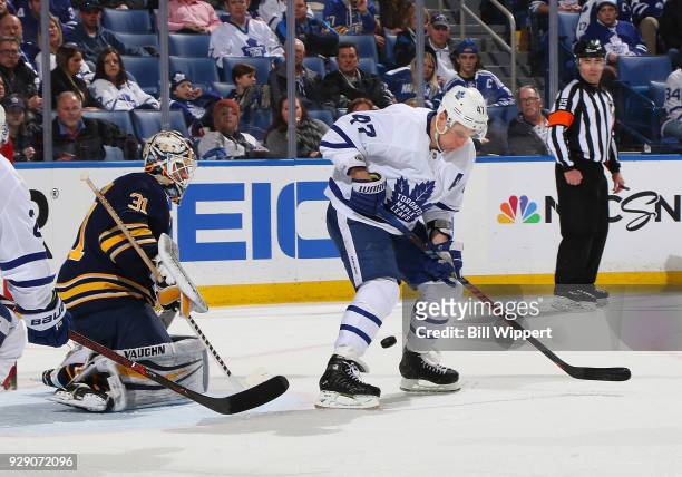Leo Komarov of the Toronto Maple Leafs deflects the puck during an NHL game against Chad Johnson of the Buffalo Sabres on March 5, 2018 at KeyBank...