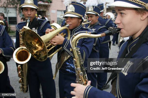 High school band practicing for the Tres Reyes Magos Three Kings Parade.