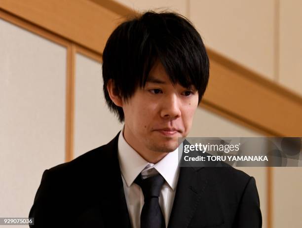 Koichiro Wada, president of Japan's virtual currency exchanges Coincheck, appears at a press conference in Tokyo on March 8, 2018. - The hack of...