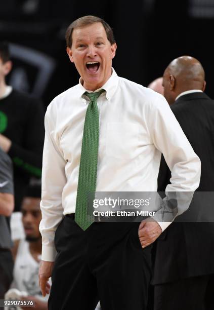 Head coach Dana Altman of the Oregon Ducks smiles during a first-round game of the Pac-12 basketball tournament against the Washington State Cougars...