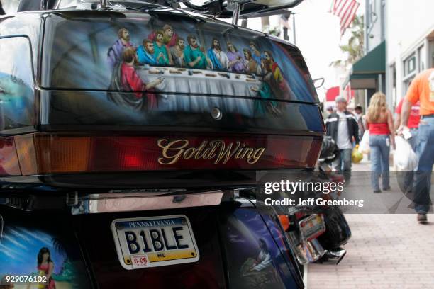 Religious license plate on a bike at Bike Week on Main Street, Daytona Beach.