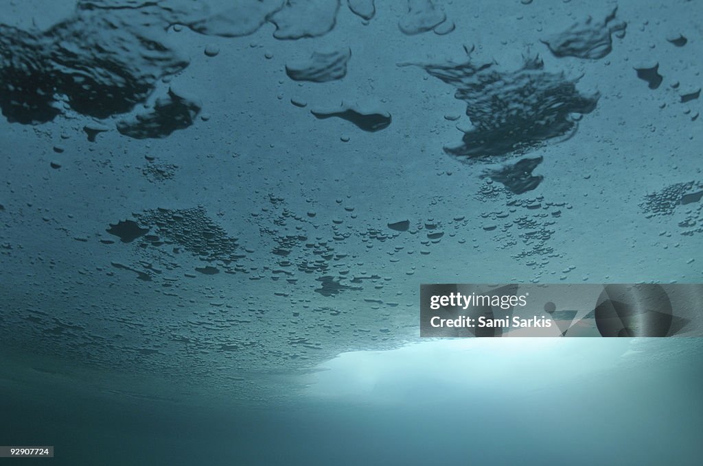 Bubbles and Ice hole, underwater