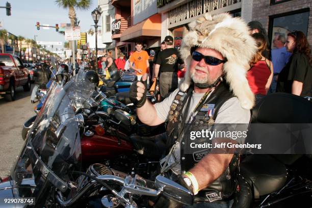 Senior man wearing a fur hat at Bike Week on Main Street, Daytona Beach.