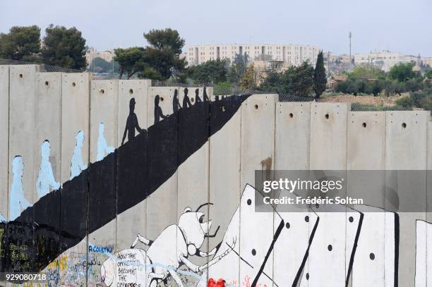 Political and social mural painting and graffitis illustrating the free Palestine and general view on the Israeli West Bank barrier in Bethlehem on...