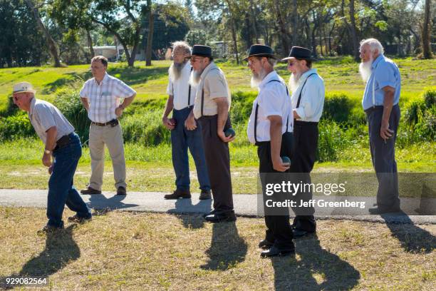 Amish men playing a game of bocce ball at Pinecraft Park.