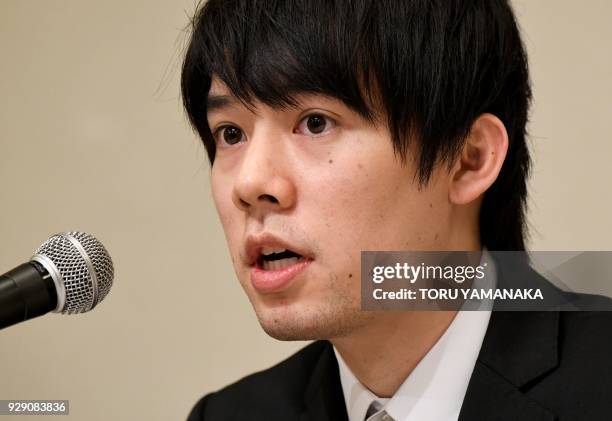 Koichiro Wada, president of Japan's virtual currency exchanges Coincheck, speaks during a press conference in Tokyo on March 8, 2018. - The hack of...