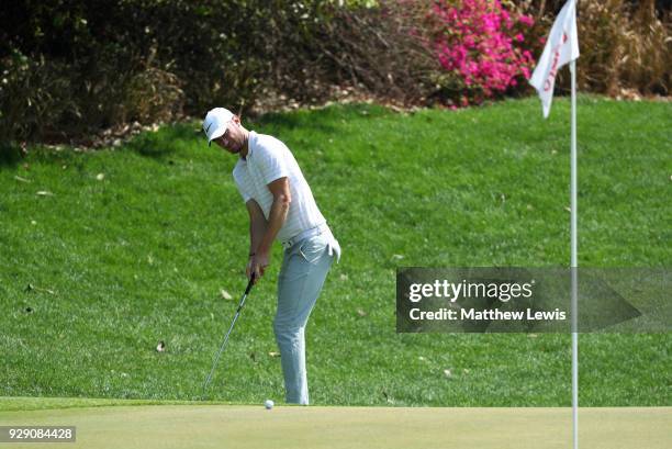 Chris Wood of England putts on the 3rd green during day one of the Hero Indian Open at Dlf Golf and Country Club on March 8, 2018 in New Delhi, India.