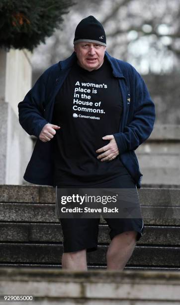 British Foreign Secretary Boris Johnson takes an early morning jog on International Women's Day wearing a T-shirt saying "A woman's place is in the...