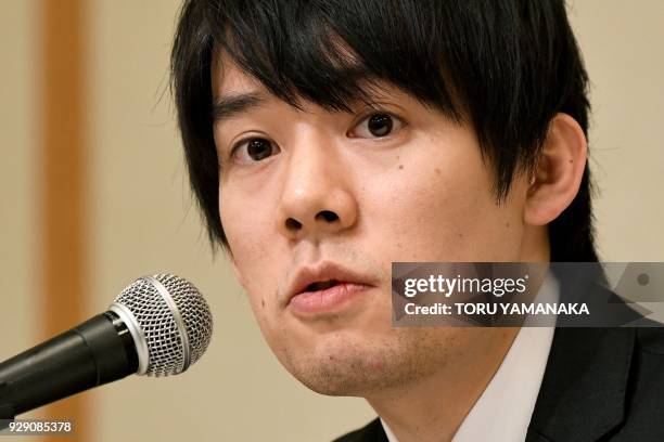 Koichiro Wada, president of Japan's virtual currency exchanges Coincheck, answers questions during a press conference in Tokyo on March 8, 2018. -...