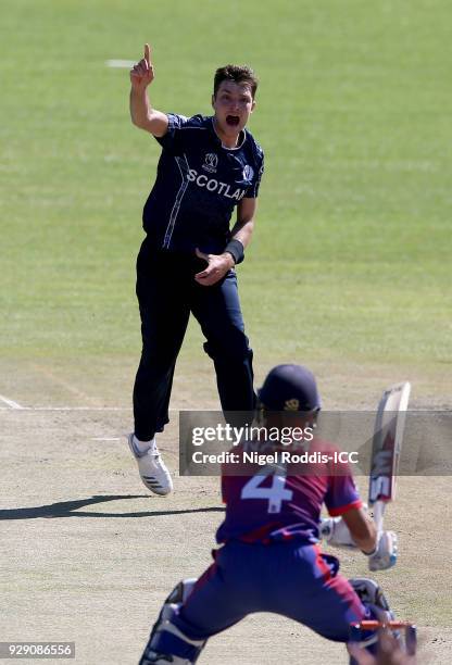 Stuart Whittingham of Scotland celebrates taking the wicket of Dilip Nath of Nepal during the ICC Cricket World Cup Qualifier between Scotland v...