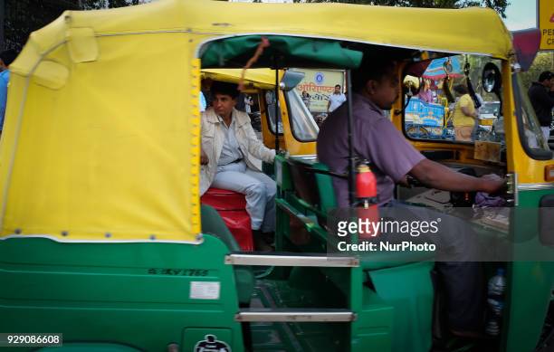 Sunita Choudhary - North India's first auto-rickshaw driver - sits in her auto-rickshaw while waiting for customers outside Patel Chowk metro station...