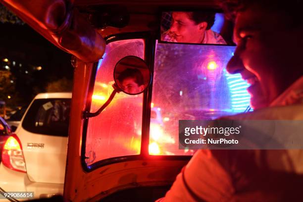 Sunita Choudhary, 40 - North India's first auto-rickshaw driver - smiles while interacting with her passengers during a ride in Central Delhi on 6th...