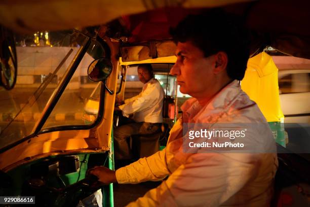 Sunita Choudhary - North India's first auto-rickshaw driver - driving at night in Central Delhi on 6th March, 2018. Sunita Choudhary - North India's...