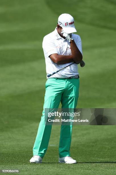 Anirban Lahiri of India reacts after he plays his third shot on the 4th hole during day one of the Hero Indian Open at Dlf Golf and Country Club on...