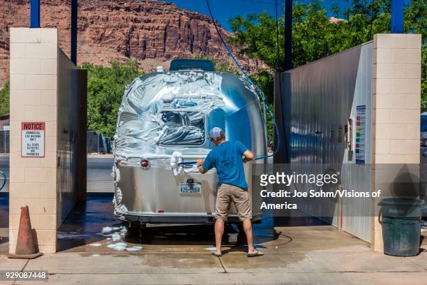 Air Stream Trailer at car wash being cleaned in Moab, Utah.