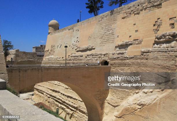 Bridge crossing moat to fortified city walls, Saint James bastion, Valletta, Malta.