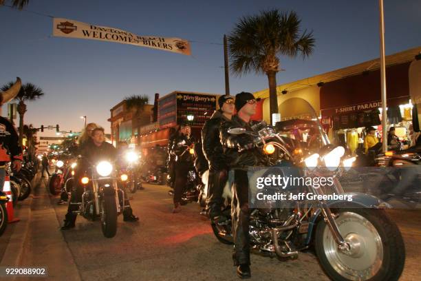 Bikers at Bike Week on Main Street, Daytona Beach at night.