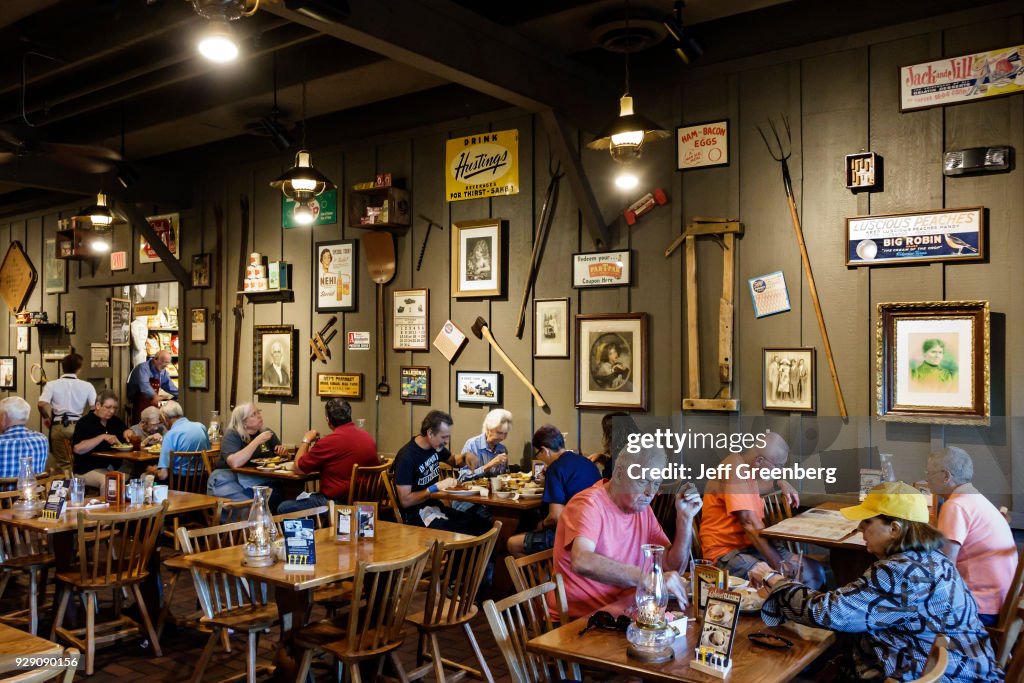 Customers dining inside Cracker Barrel Country Store restaurant.