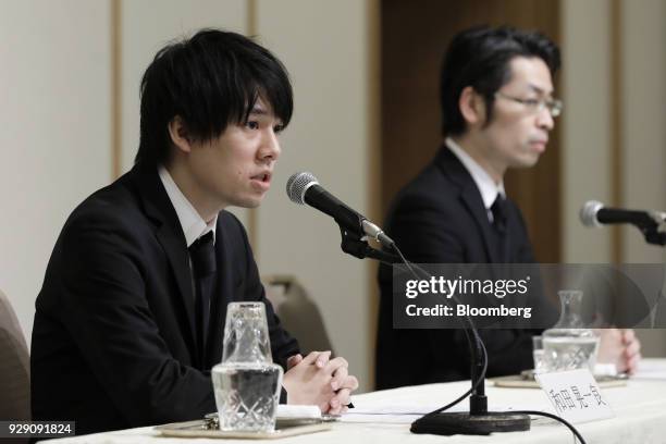 Koichiro Wada, president of Coincheck Inc., left, speaks while Yusuke Otsuka, chief operating officer, look on during a news conference in Tokyo,...