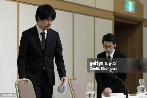 Koichiro Wada, president of Coincheck Inc., left, and Yusuke Otsuka, chief operating officer, arrive for a news conference in Tokyo, Japan, on...