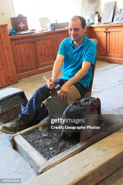 Demonstration of slate working, National slate museum, Llanberis, Gwynedd, Snowdonia, north Wales, UK.