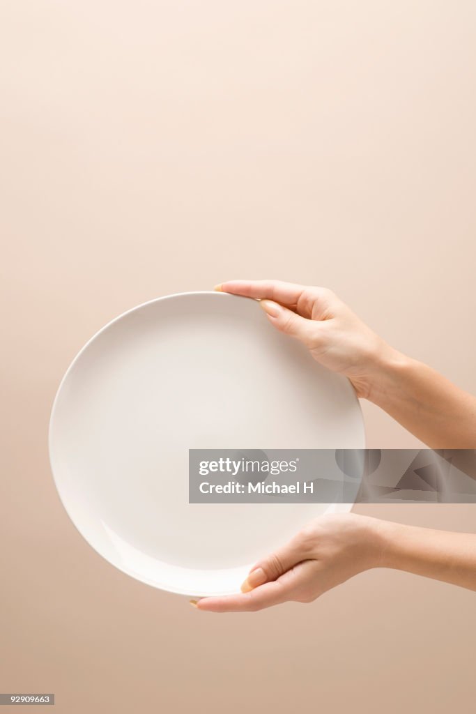 Hand with plate